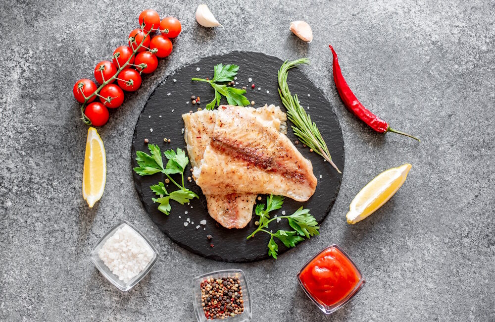 Baked,White,Fish,Fillet,Pangasius,With,Spices,And,Lemon,On